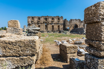 Wall Mural - Aspendos or Aspendus, an open-air museum, an ancient Greco-Roman city in Antalya province of Turkey.  Selective focus