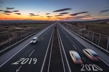 Wall Mural - Driving on open road at beautiful sunny day to new year 2020. Aerial view