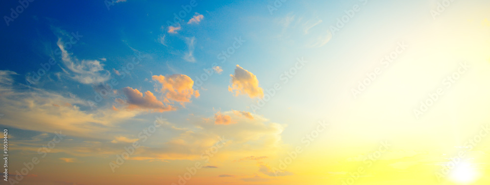 Scenic sunset with sun rays against bright blue sky - obrazy, fototapety, plakaty 