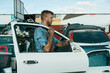 © Nomad_Soul - Male repairman holds door on car junkyard