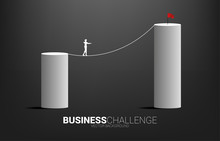 Silhouette Of Businessman Walking On Rope Walk Way To Higher Bar Chart.Concept For Business Risk And Career Path
