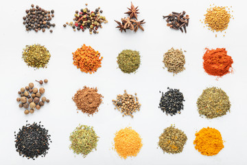 Many different spices on white background