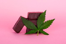 Chocolates Candy With Marijuana On Pink Background, Cannabis Sweets