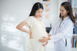 © torwaiphoto - Asian doctor is examining the pregnant woman