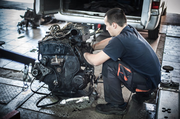 Wall Mural - Removed engine from car. Auto mechanic repairs car engine