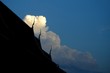 © Thummachart - silhouette of man on top of mountain