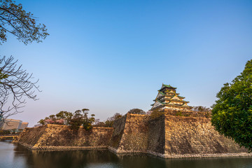 Osaka castle with full bloom cherry blossom beauiful Sakura tree at japan cherry blossom  forecast pink asian flower perfact season to travel and enjoy japanese culture idea long weekend relax