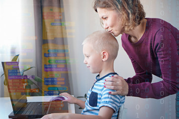 young programmer writing code on a computer together with his mom or teacher. programming lessons fo