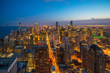 Beautiful scenic view of business district of Chicago loop with skyline in evening sunlight. Panoramic view aerial top view or drone architecture view of city. Famous attraction in Chicago, USA.