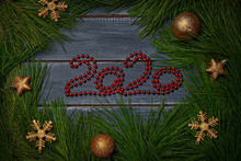 Christmas Flat Barking Numbers 2020 Made Of Red Garland Decorated With Cedar Branches With New Year's Gold Balls Of Different Colors. Mock Up For Santa Claus Letter And Christmas Designs