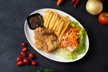 Wall Mural - deep fried chicken steak with fries and black pepper sauce