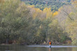 © goodluz - fly fisherman in river in autumn