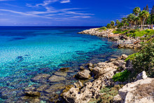 Sea Turquoise Water, Stone Beach And Blue Sky Landscape In Fig Tree Bay, Protaras, Cyprus.