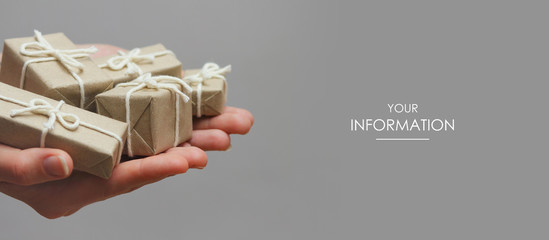 hands hold set of gift boxes. delivery service. gray background. gift exchange. web article template