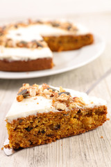 Wall Mural - carrot cake with cream and nuts, slice