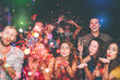 © Alessandro Biascioli - Happy friends doing party throwing confetti in nightclub - Group young people having fun celebrating new year holidays together in disco club - Youth culture entertainment lifestyle concept