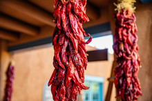Red Chili Peppers Dried Hanging On A Traditional Building Entrance, Santa Fe New Mexico