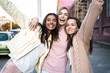 © opolja - Outdoor shot of three young women having fun on city street