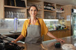 © Rido - Proud waitress standing at counter