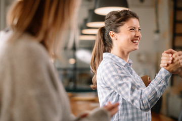 Business people in office talking. Beautiful businesswoman talking with colleagues.