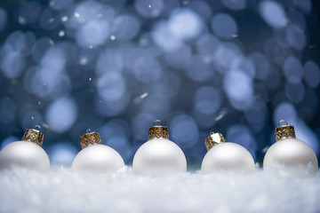 Wall Mural - Christmas card.Christmas Toys in the snow with a bright background and falling snow.