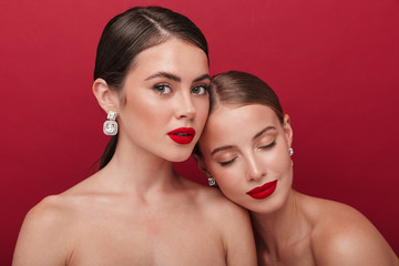 Wall Mural - Beautiful young two women with bright red lipstick