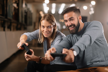 Poster - Happy young couple. Couple playing video game. 