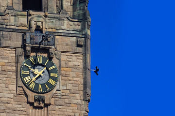 Wall Mural - Clock at Charlottenburg Town Hall, blue sky. Rathaus Charlottenburg, Berlin, Germany