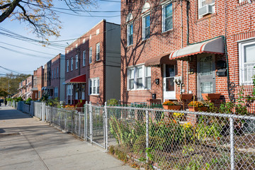 Wall Mural - A Row of Old Fenced In Homes in Astoria Queens New York