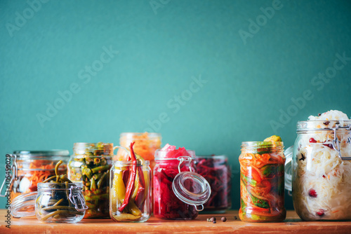 Assortment of various fermented and marinated food over wooden background, copy space Tableau sur Toile