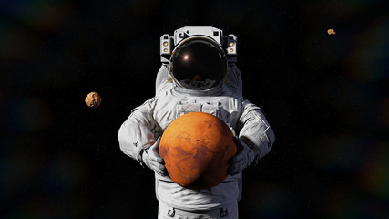 Wall Mural - astronaut holding mars, phobos and deimos orbiting the planet