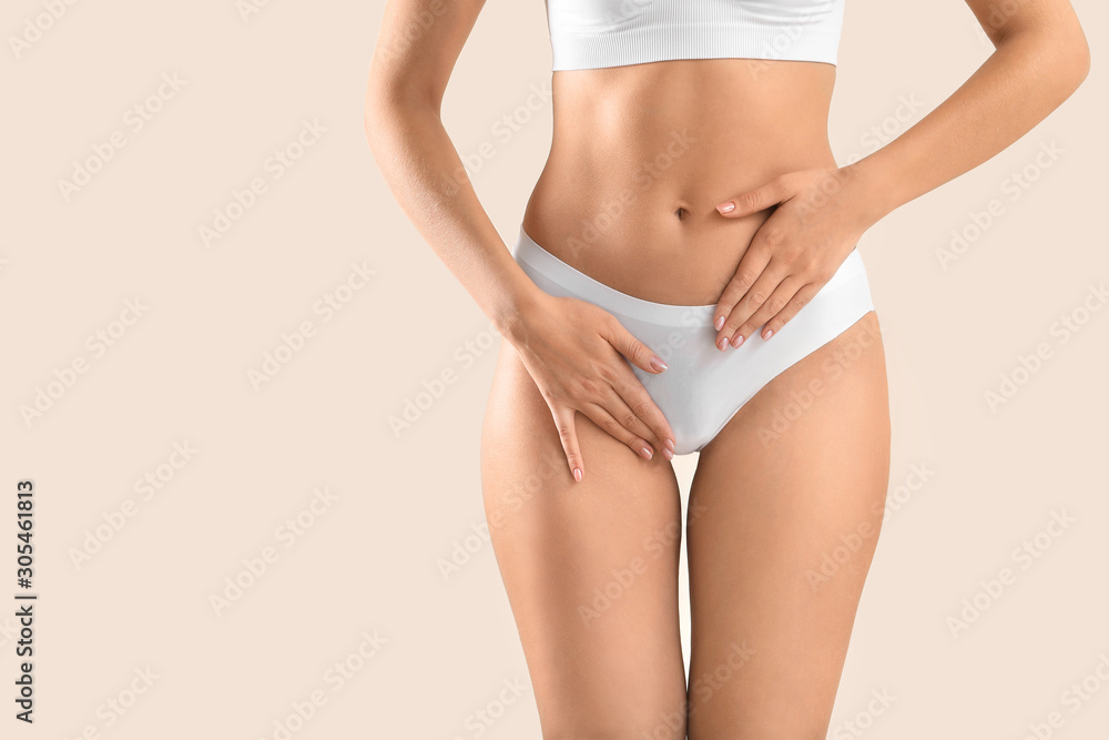 Young woman on light background, closeup. Gynecology concept - obrazy, fototapety, plakaty 
