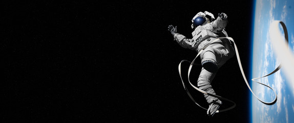 Wall Mural - astronaut in orbit of planet earth