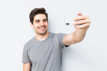 Happy Young Man Taking A Selfie Photo Isolated On White Background