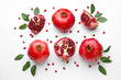 Ripe tasty pomegranates on white background