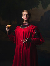 Handsome Man In A Royal Red Doublet Eating Fast Food
