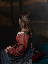 Back View Portrait Of A Young Woman In The Style Of A Renaissance Painting.