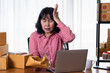 © KanyaphatStudio - Asian women shop online  are stressed with damaged goods boxes. After customers claim products