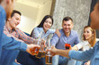 © Viktoriia - Group of friends having party indoors fun together cheers close-up