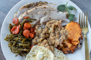 Wall Mural - Plated roasted turkey, stuffing, and sides flat lay
