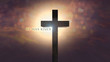 Easter background with Jesus Christ cross on an amazing sky at sunrise and He has risen text. Resurrection concept. Christian wooden cross in the Easter morning