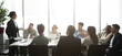 © Prostock-studio - Professional business team having brainstorm meeting, panorama