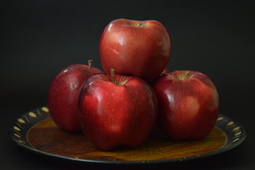 Red Apples On Wooden Plate Black Background