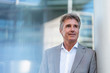 © Westend61 - Portrait of confident mature businessman in the city