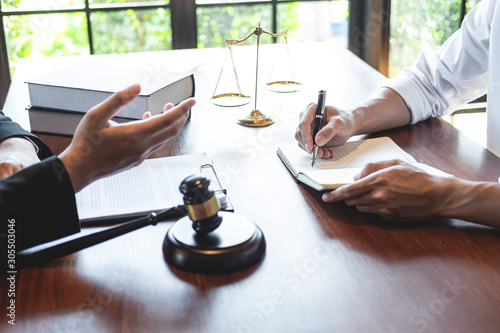 Fotomural Professional male lawyer or counselor discussing negotiation legal case with cli