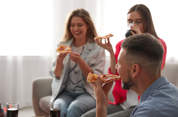 Wall Mural - Group of friends eating tasty pizza at home