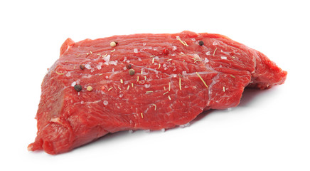 Fresh raw beef cut with spices isolated on white