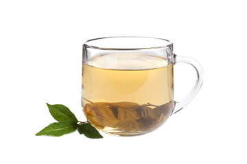 Cup of green tea and leaves isolated on white