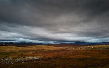 Poster - Dark storm clouds building over the Torridon mountains in winter  in the North West Highlands of Scotland, UK.