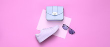 Fashion Girl Outfit. Woman Accessories Set. Minimal Creative Hipster Pink Flat Lay. Fashion Sneakers Shoes, Trendy Purple Handbag, Glamour Fashionable Sunglasses On Pink